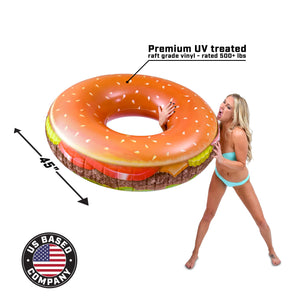 a woman in a bikini is holding a giant hamburger