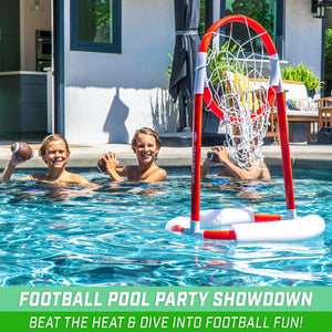 two people in a pool with a basketball hoop