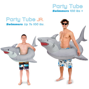 a man in a bathing suit holding a shark