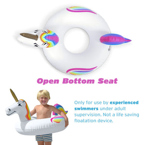 a woman in a swim suit holding a unicorn float