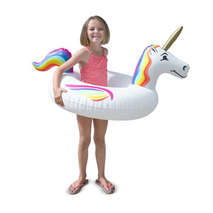 a girl in a unicorn inflatable