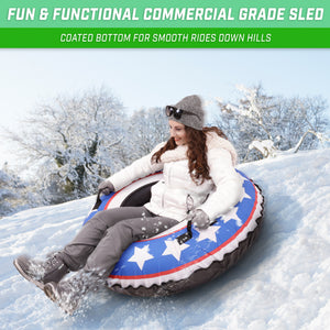 woman on top of snow tube going down the hill