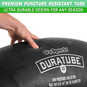 a person holding a large black ball with the words, ' premium '