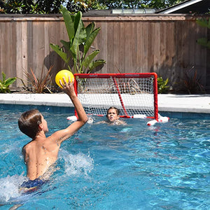child holding yellow ball in the pool with polo goal in frame